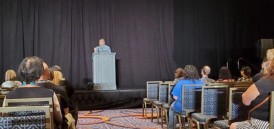 Author Ken Liu stands at a podium.
